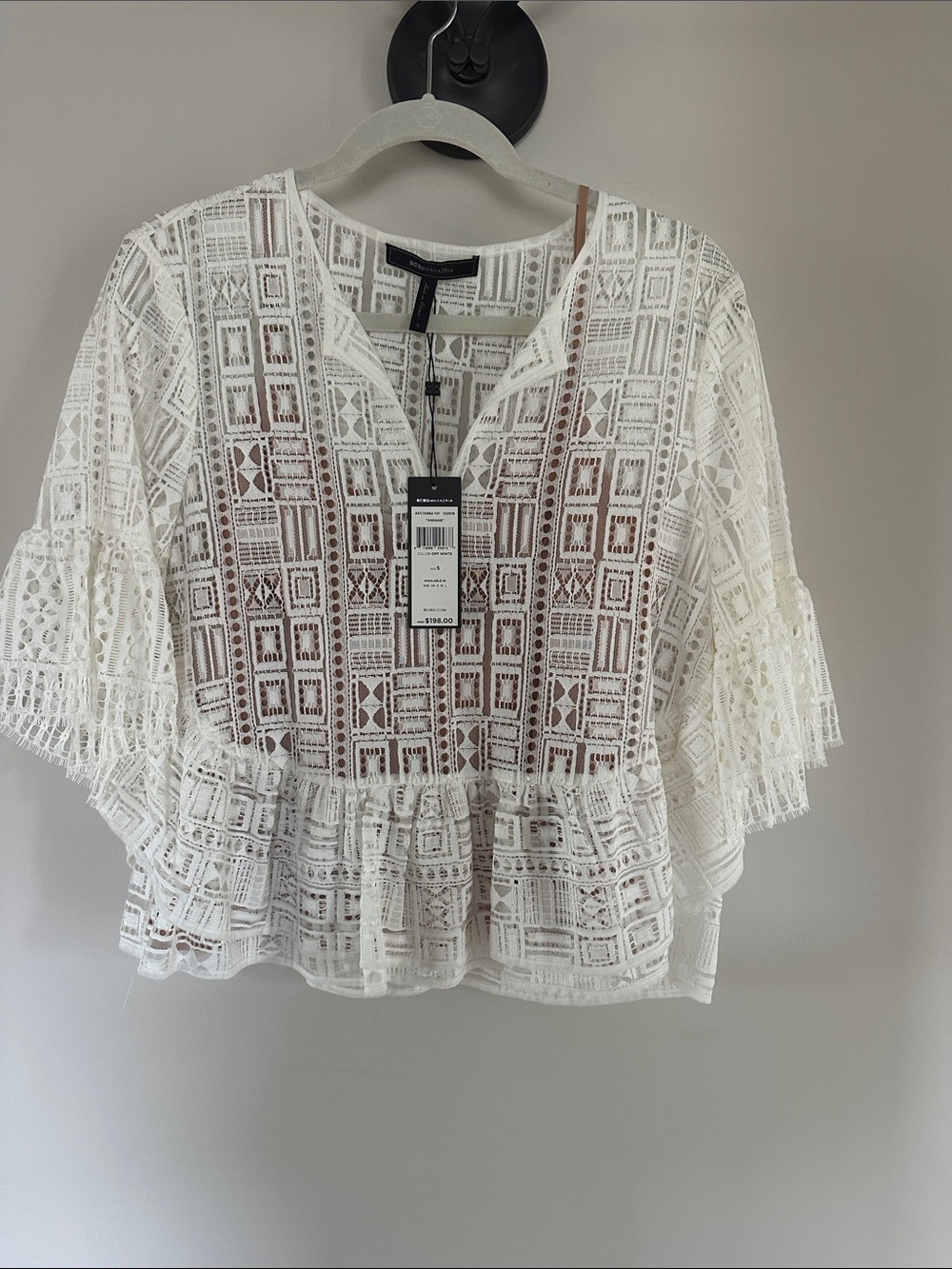 BCBG MAXAZRIA White Lace Ruffle-Hem Blouse with tan under camisole.